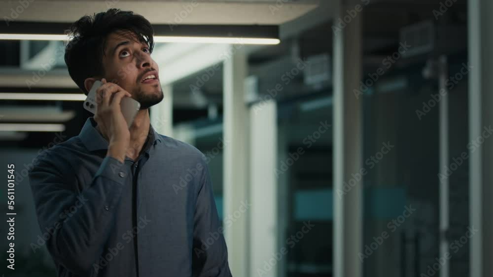 Businessman speaking mobile phone in office indian arabian adult man lawyer employee consult distant client give legal advice use cellphone remote cell communication talking with smartphone indoors Businessman speaking mobile phone in office indian arabian adult man lawyer employee consult distant client give legal advice use cellphone remote cell communication talking with smartphone indoors