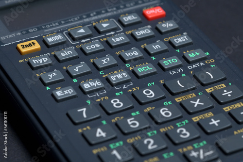Scientific calculator isolated on black paper background