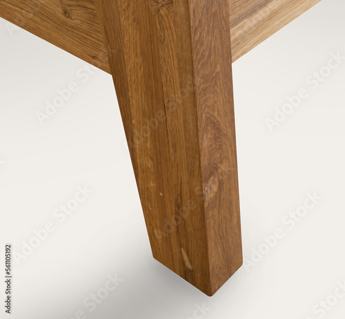 Wooden bed leg close view photo, wooden eco furniture elements background. Solid wood furniture leg