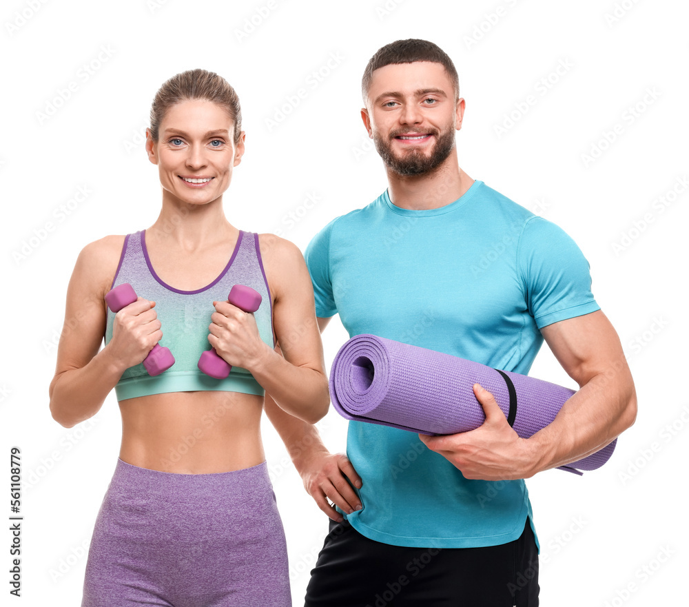 Athletic people with dumbbells and fitness mat on white background Athletic people with dumbbells and fitness mat on white background