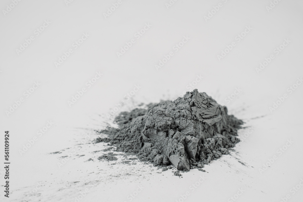 Silicon carbide powder close-up isolated on white background. Silicon carbide abrasive grit for restore stones to original flatness and leveling sharpening stones. - obrazy, fototapety, plakaty 