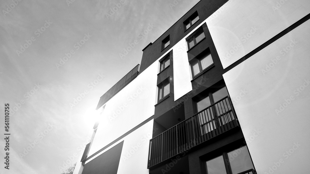 Fototapeta premium Apartments in residential complex. Housing structure at modern house. Architecture for property investment. and architecture details. Urban abstract - windows of apartment building. Black and white.