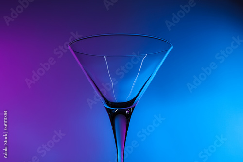 Empty clean martini glass in neon lights