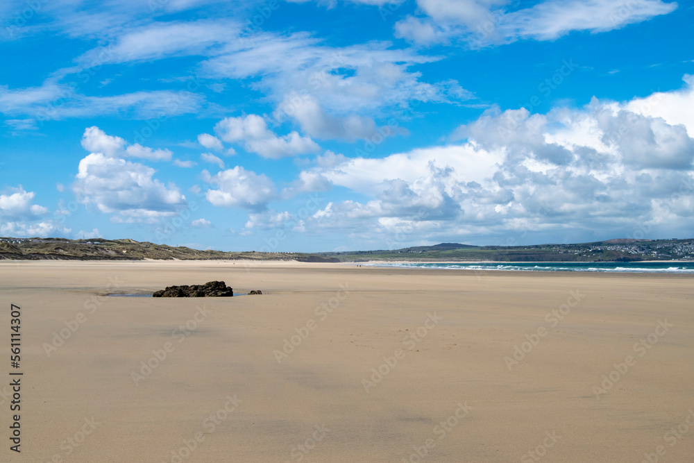 A picturesque beach on a sunny day in Cornwall, UK.