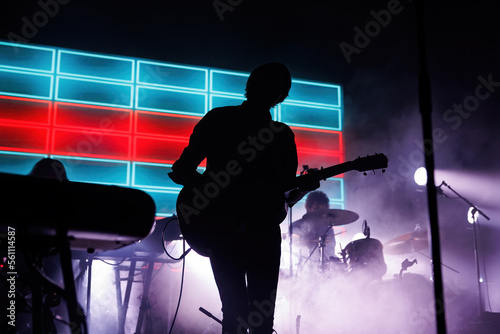 silhouette of a person with a guitar