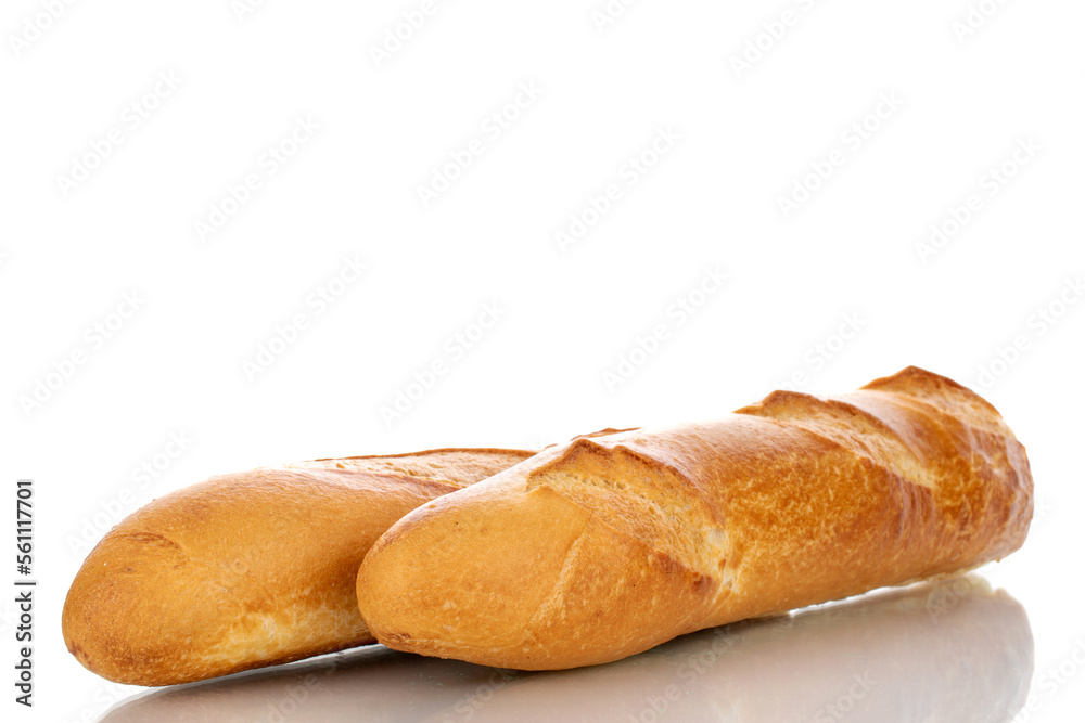 Two fresh fragrant baguettes, macro, isolated on white background.