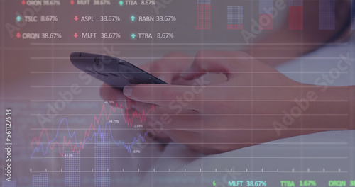 Stock market data processing against mid section of a woman using smartphone in the bed photo