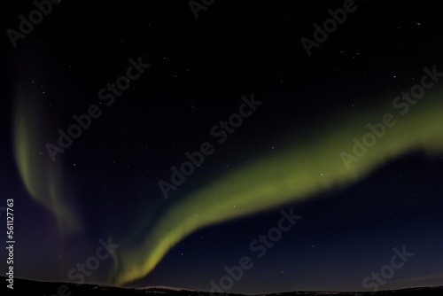 Northern lights, aurora borealis, over winter sky of Alaskan wilderness near Fairbanks, Alaska