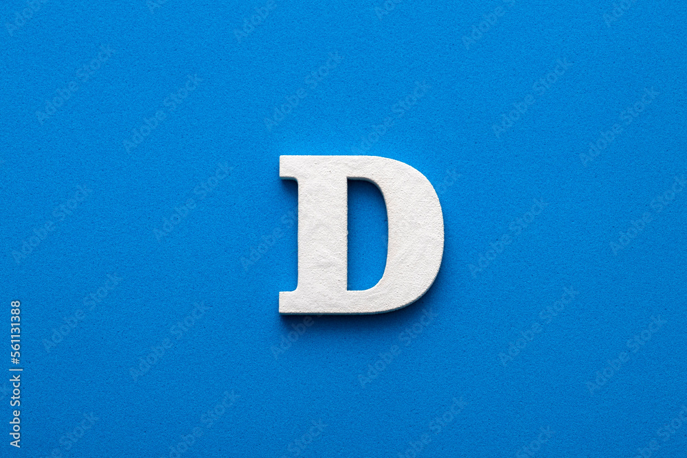 Letter D uppercase - White wood font on blue foamy background Letter D uppercase - White wood font on blue foamy background