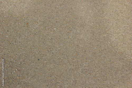 Beach wet coarse brown sand Texture for background.