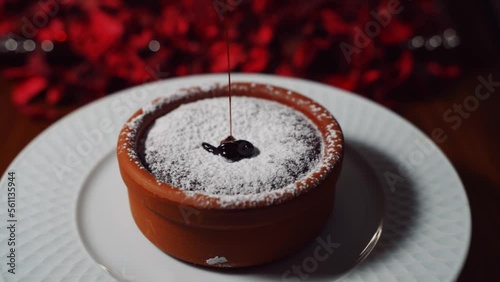 Hot Chocolate souffle.  souffle presentation chocolate dessert fiery.  photo