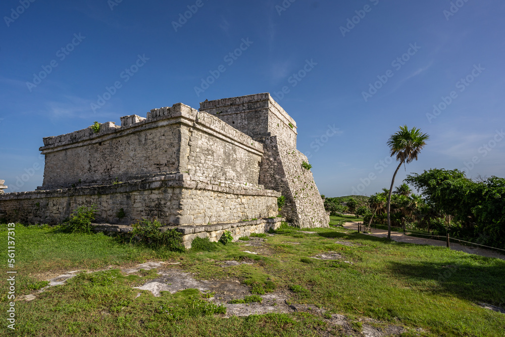 The ruins of a beautiful pyramid in the archaeological zone of Tulum in Mexico.