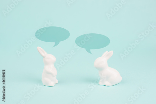 Easter bunny talking together  rabbits have a conversation  spring holiday greeting card with speech bubbles 