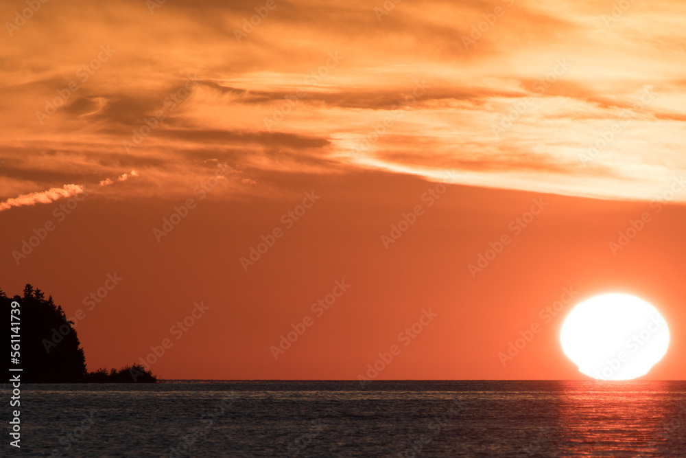 Orange Sun Setting Over Lake