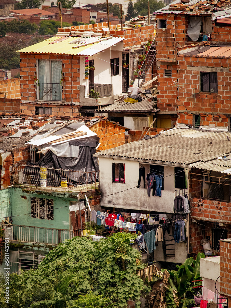 The comuna 13 neighborhood in Medellin, Colombia has transformed from a former ghetto to a well-developed area, with stacked houses as a unique feature.