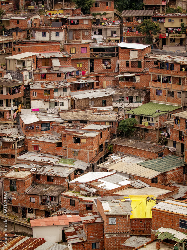 The comuna 13 neighborhood in Medellin, Colombia has transformed from a former ghetto to a well-developed area, with stacked houses as a unique feature. The comuna 13 neighborhood in Medellin, Colombia has transformed from a former ghetto to a well-developed area, with stacked houses as a unique feature.