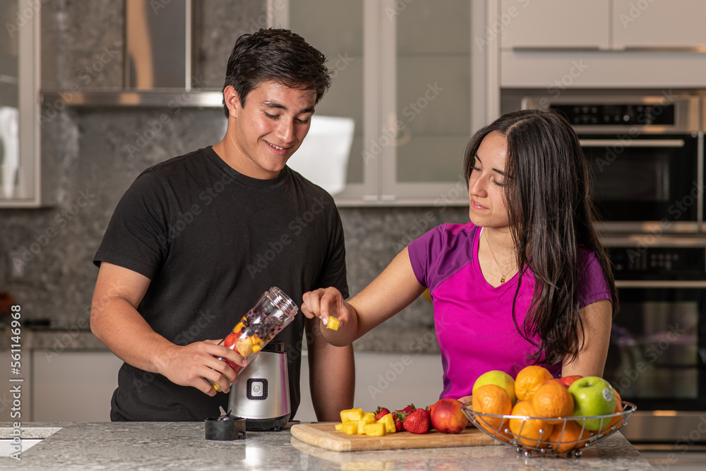 Couple preparing a smoothie