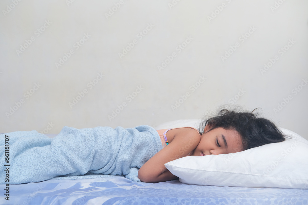 Asian kid sleeping tightly in her bed wearing blanket Asian kid sleeping tightly in her bed wearing blanket