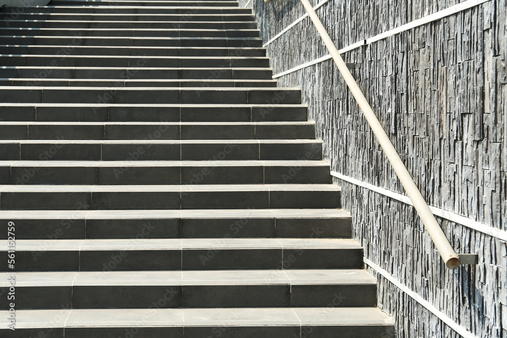 Stairs with metal handrailing outdoors on sunny day Stairs with metal handrailing outdoors on sunny day