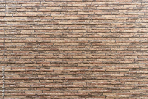 A brick-like wall seen in the city