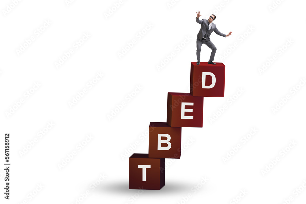 Debt and loan concept with businessman on cubes Debt and loan concept with businessman on cubes