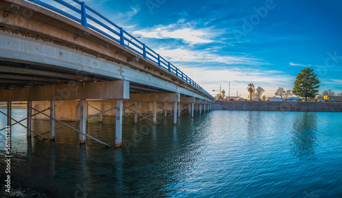 Bataan Memorial Bridge over the tranquil Lake Carlsbad, the Lower Transill Lake of Pecos River in Eddy County, New Mexico, USA © Naya Na