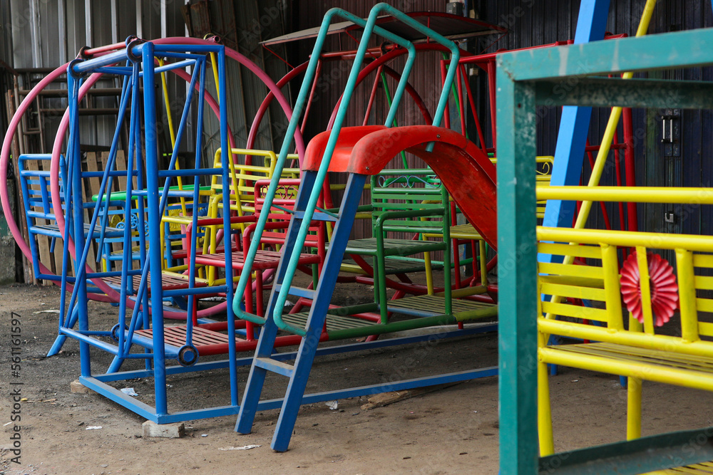 workshop where slides and iron swings are made.. playground for children