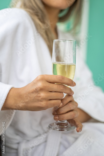 hand holding a glass goblet with a champagne drink, celebration and leisure activity © Alejandro