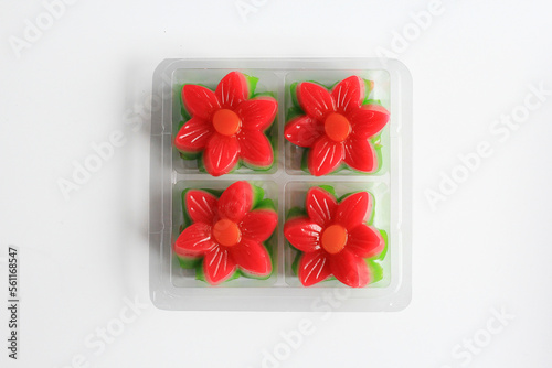 Kue Lapis Bunga or Kue Pepe or sticky layer cake or lapis flower cake, isolated on white background. Kue lapis bunga is Indonesian traditional snack made from glutinous rice flour.