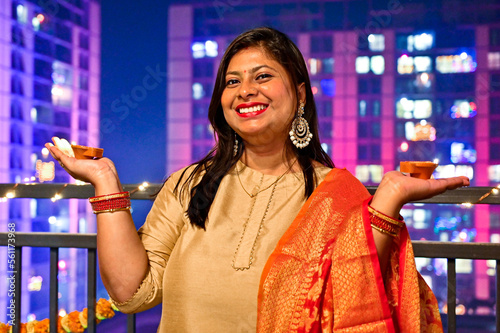 woman with oil lamps. Oil candles. Happy Diwali Time. Hindu holidays and festivals  photo