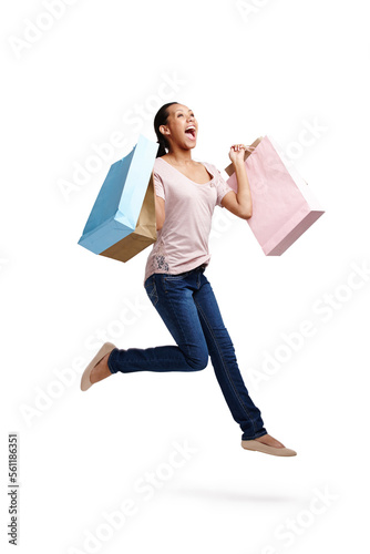 Success, fashion and woman jump with shopping bags in studio isolated on white background mock up. Discount celebration, sales deals and happy female customer jumping with gifts after buying at mall