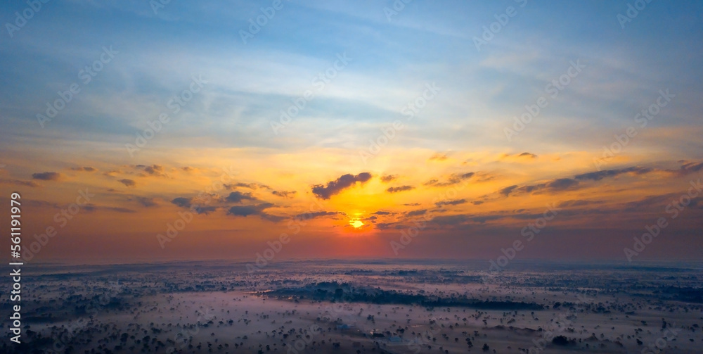 Panorama Top view Aerial photo from flying drone over nature field in Thailand.Top view beautiful Sunset.Sunrise with foggy on field background.