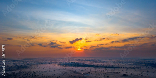 Panorama Top view Aerial photo from flying drone over nature field in Thailand.Top view beautiful Sunset.Sunrise with foggy on field background.