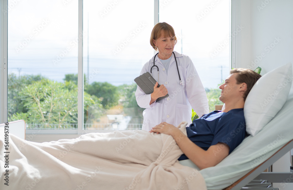 Portrait of caucasian doctor check up body of sick patient on bed in hospital in medical and healthcare treatment at nursing home or clinic. People lifestyle Portrait of caucasian doctor check up body of sick patient on bed in hospital in medical and healthcare treatment at nursing home or clinic. People lifestyle
