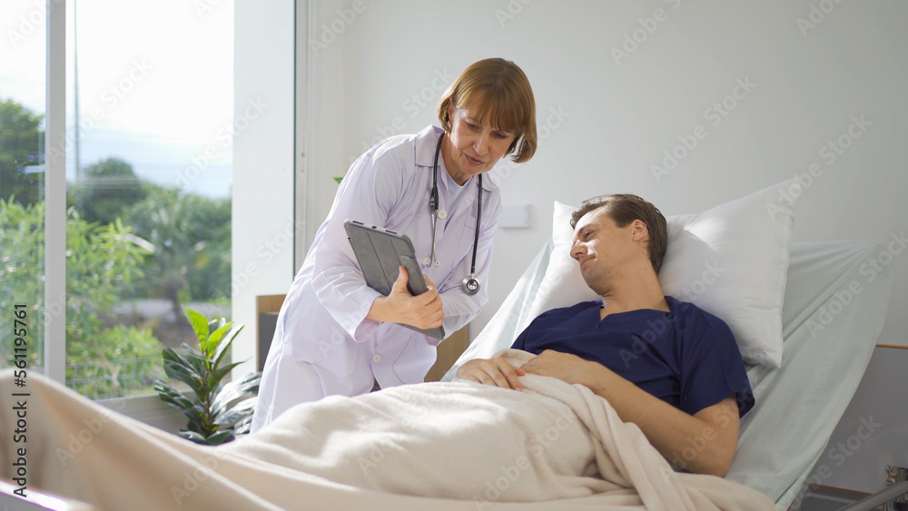 Fototapeta premium Portrait of caucasian doctor check up body of sick patient on bed in hospital in medical and healthcare treatment at nursing home or clinic. People lifestyle