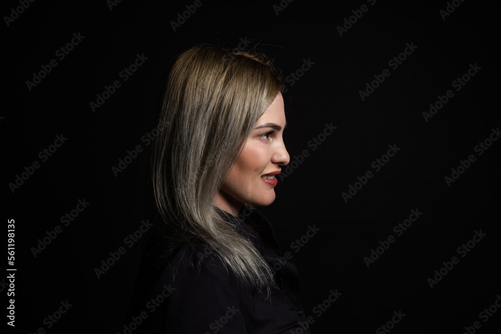 woman in black on a black background