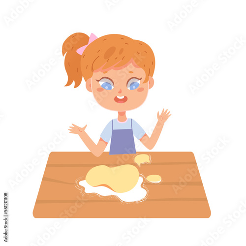 Girl baking, little kid kneading dough with hands on kitchen table to bake bread, cake