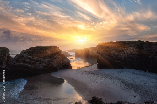 Cathedrals beach (Playa de las Catedrales) or Praia de Augas Santas at sunrise, amazing landscape with rocks on the Atlantic coast and colored sky, Ribadeo, Galicia, Spain. Outdoor travel background