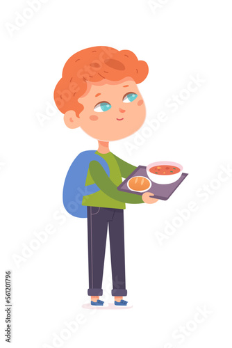 Cute kid eating healthy meal in school canteen, hungry boy standing and holding tray