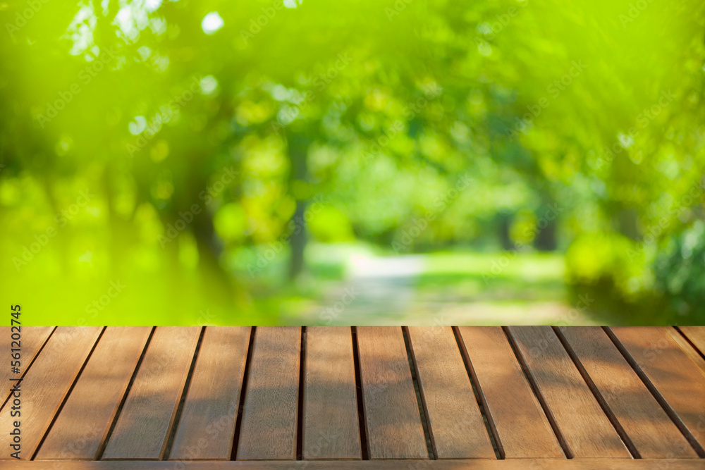 wooden table with park bokeh background