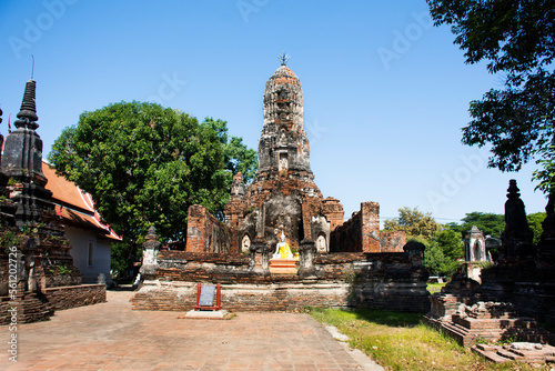 Ancient antique buddha statue and ruins old chedi stupa for thai people travel visit respect praying blessing wish in Wat Choeng Tha pagoda or Koy Tha temple on December 30, 2022 in Ayutthaya Thailand