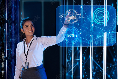 Female Technician touching on digital globe screen, future technology concept