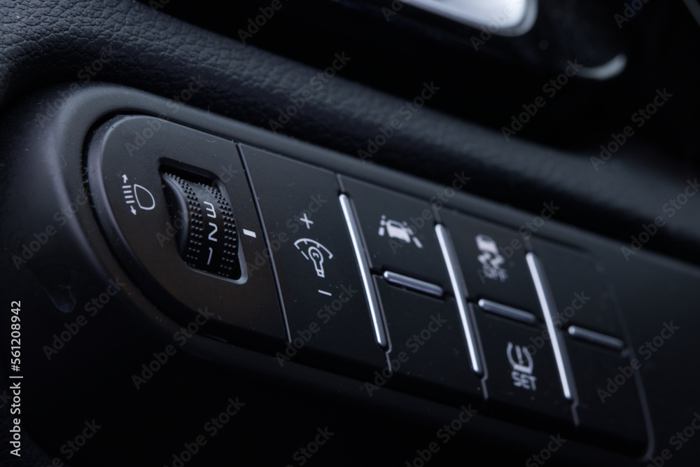 Obraz premium Close-up of the headlight setting buttons. Selective focus.