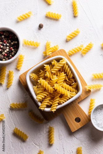 Uncooked pasta in a bowl photo