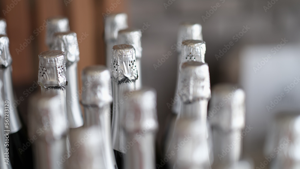Silver bottles of champagne in row in bar closeup