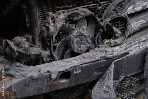 Burnt engine compartment of modern car closeup