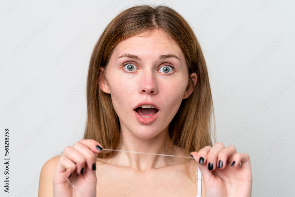 Young English woman with dental floss. Close up portrait Young English woman with dental floss. Close up portrait