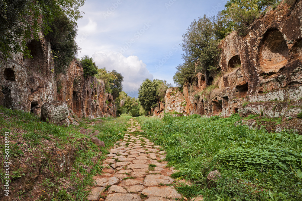 Civita Castellana, , Viterbo, Lazio, Italy: rock tombs in Falisci necropolis, over 2300 years old, and the ancient Roman road Via Amerina in the Etruscan archaeological site Cavo degli Zucchi Civita Castellana, , Viterbo, Lazio, Italy: rock tombs in Falisci necropolis, over 2300 years old, and the ancient Roman road Via Amerina in the Etruscan archaeological site Cavo degli Zucchi