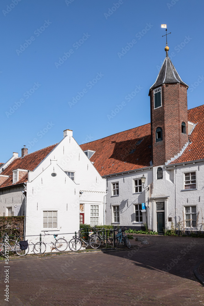 White painted 16th century house with octagonal stair tower in the center of Amersfoort.