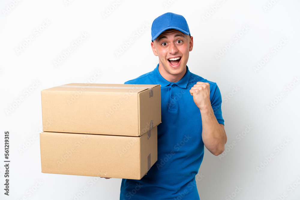 Young delivery Brazilian man isolated ops white background celebrating a victory in winner position